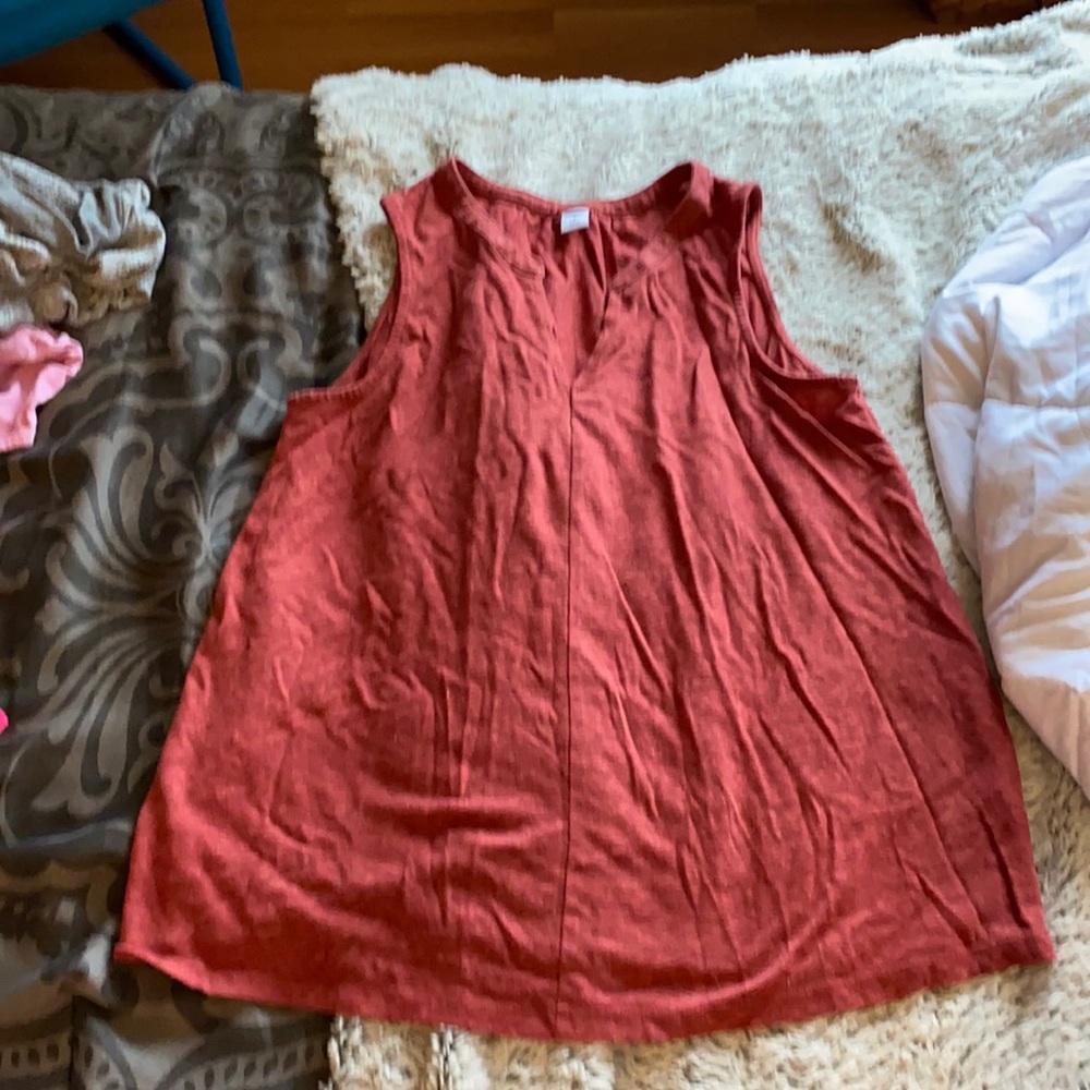 Red sleeveless shirt